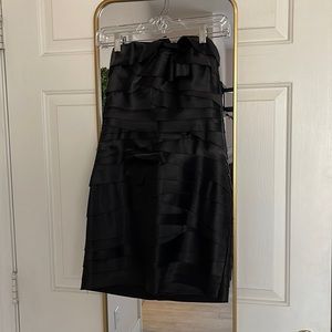 Black strapless Medium Bebe dress.